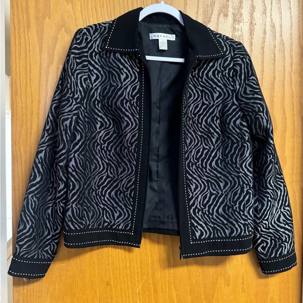 Black and grey zip up blazer.